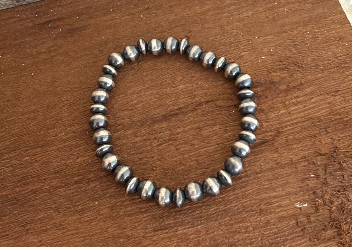 7mm Graduated 925 Sterling Silver Pearl Stretch Bracelet β Machine Made